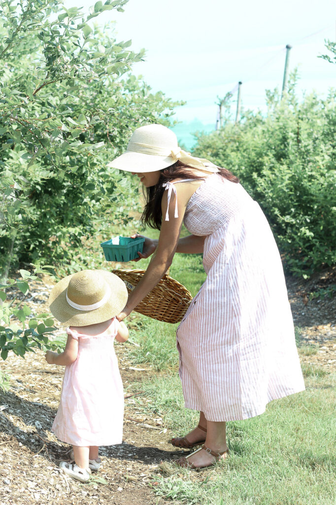 mother and daughter blueberry picking Tougas Family Farm