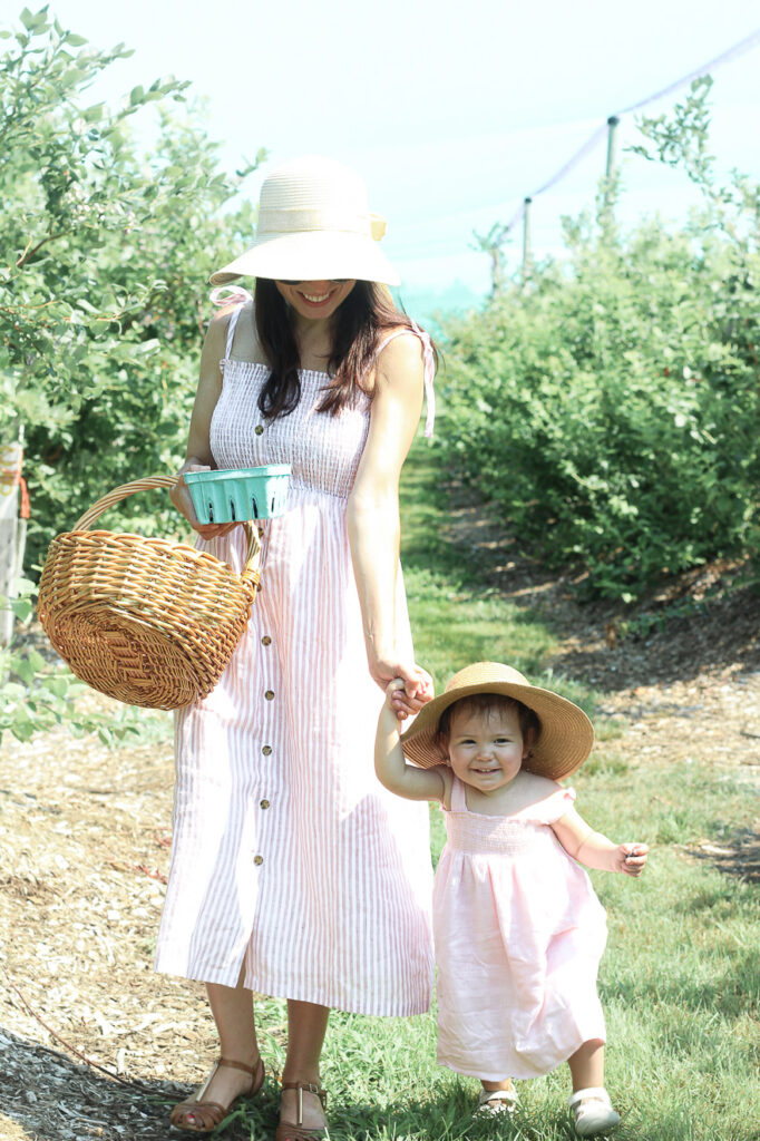 mother and daughter blueberry picking Tougas Family Farm